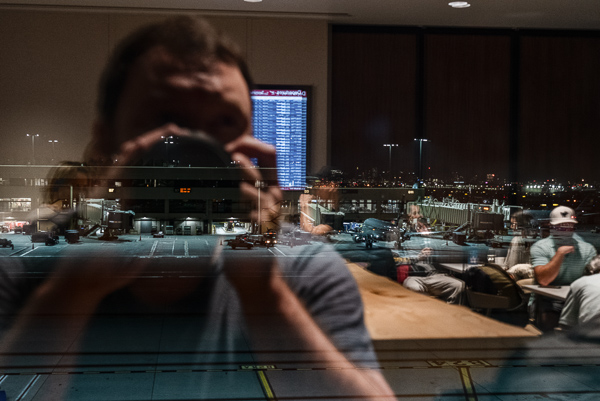 Reflection in window of airport lounge